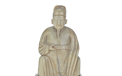 A MOTTLED PALE GREY-CELADON JADE CARVING OF A SCHOLAR 17th...