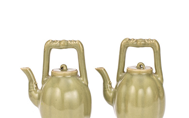 A PAIR OF CELADON-GLAZED TEAPOTS AND COVERS Qianlong seal marks,...