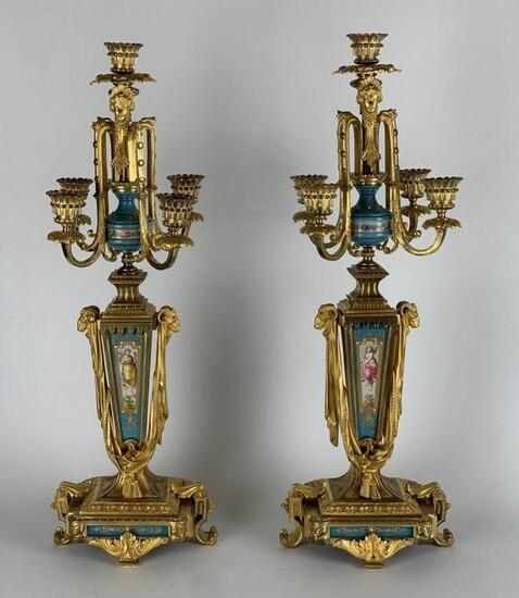 A PAIR OF JEWELED ORMOLU MOUNTED SEVRES CANDELABRA