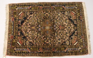 A PERSIAN RUG, 20TH CENTURY, dark blue ground with