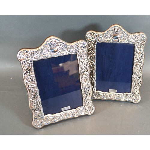 A Pair of 925 Silver Photograph Frames of embossed shaped fo...
