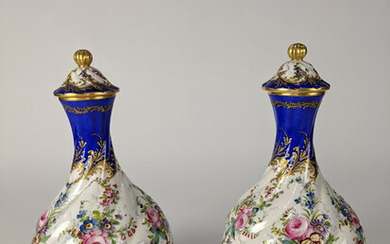 A Pair of Continental porcelain lidded vases