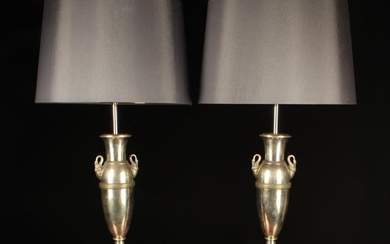 A Pair of Decorative Silver Plated Side Lamps. The French Empire style urn-shaped stands having orna