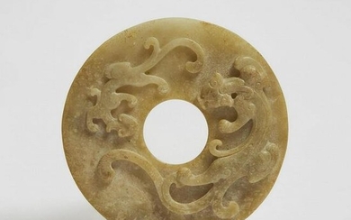 A Pale Celadon 'Chilong' Jade Bi Disc, Ming Dynasty