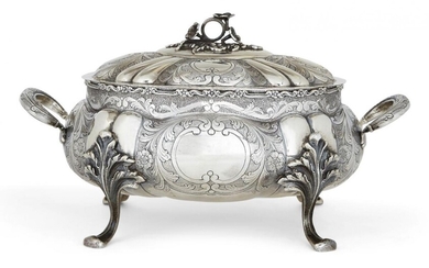 A Portuguese or Brazilian soup tureen,the underside stamped prata 833 for silver, lid unmarked, of shaped oval form with lobed body and twin-handles, the body with vacant cartouches to either side and raised on four foliate shouldered feet, the lid...