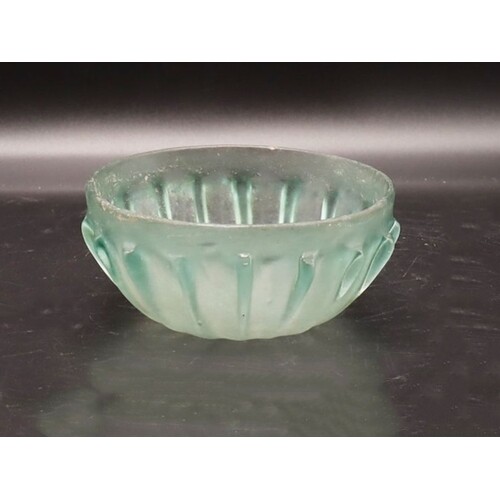 A ROMAN GLASS RIBBED BOWL Pale blue-green in color, the h...