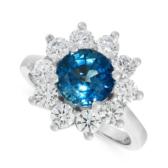 A SAPPHIRE AND DIAMOND CLUSTER RING in platinum, set