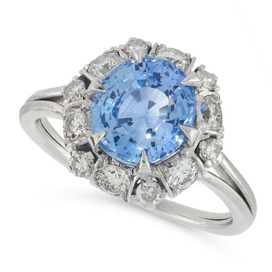 A SAPPHIRE AND DIAMOND DRESS RING set with a cushion