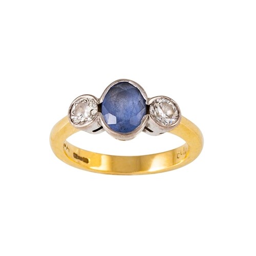 A SAPPHIRE AND DIAMOND THREE STONE RING, the oval sapphire a...