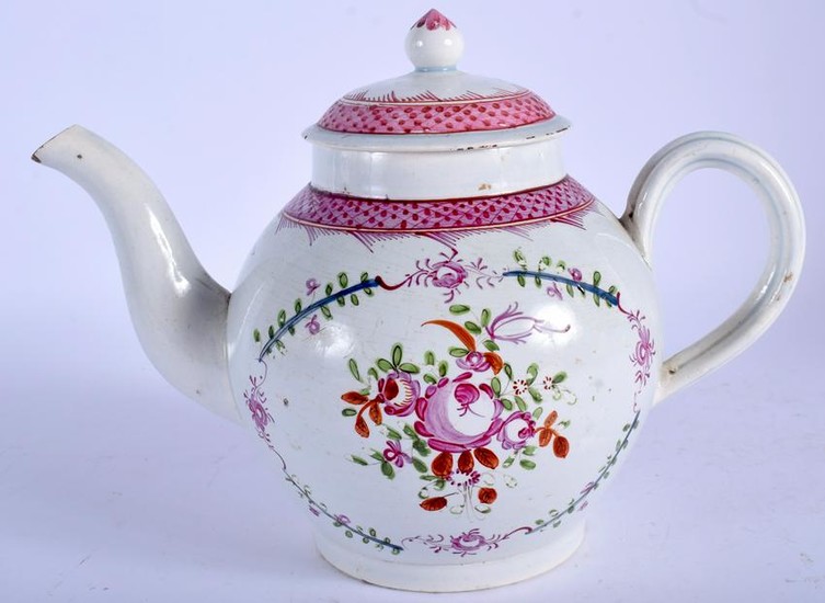 A STAFFORDSHIRE POTTERY TEA POT, painted with foliage.