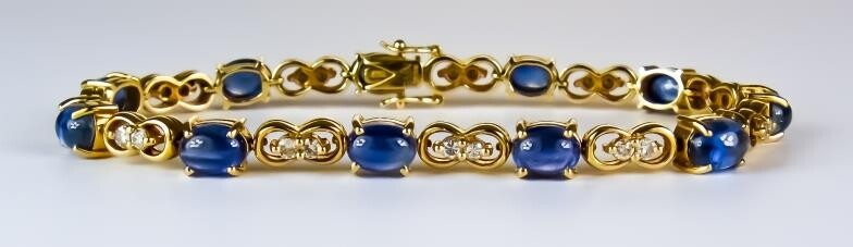 A Sapphire and Diamond Line Bracelet, Modern, 18ct gold...