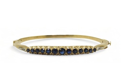 A Sapphire and diamond bangle with 9ct gold hallmarks for Lo...