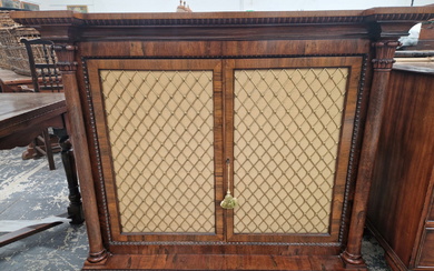 A VICTORIAN ROSEWOOD SIDE CABINET WITH COLUMNS FLANKING THE GRILLED DOORS, EGG AND DART BANDS
