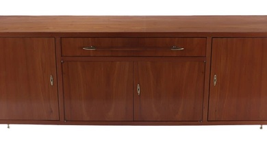 A WALNUT MID CENTURY MODERN SIDEBOARD HAVING FOUR DOORS AND...