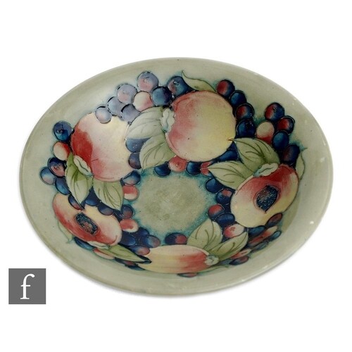A William Moorcroft bowl decorated in the Pomegranate patter...