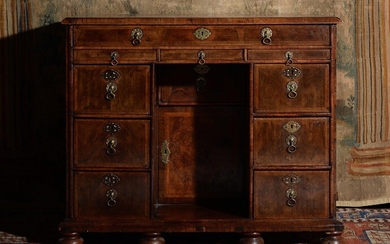 A William & Mary walnut and feather banded kneehole desk