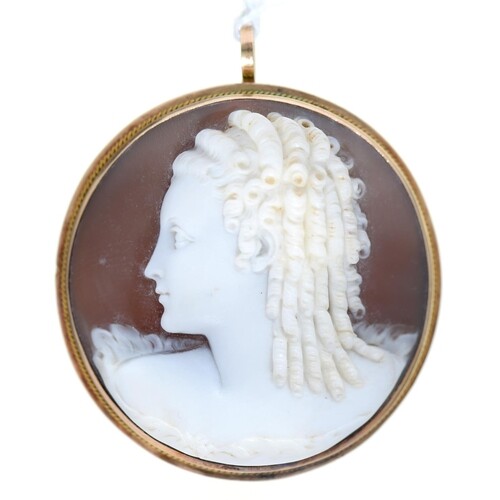 A cameo brooch pendant, early 20th c, carved with the h...