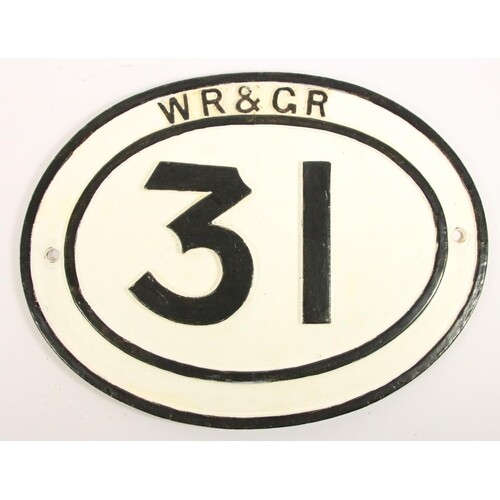 A cast iron oval bridge plate, WR & GR 31