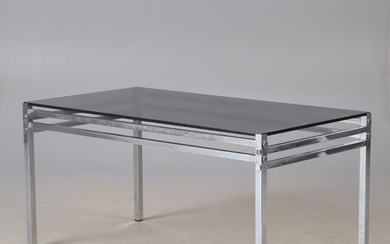 A chrome coffee table with black tinted glass top, later part of the 20th century.