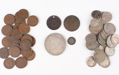 A collection of USA coinage, including a Peace dollar 1922, a silver three cents 1862, a group of In