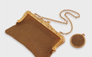 A collection of two fourteen karat gold mesh evening...