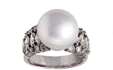 A cultured pearl and diamond ring, centring on a cultured pearl measuring 13.3mm to a tapering band, the shoulders set with brilliant- and marquise-cut diamonds, ring size P