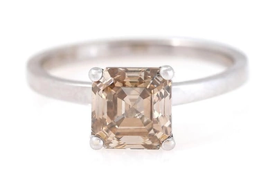 A diamond ring set with a Fancy Yellowish Brown Asscher-cut diamond weighing...