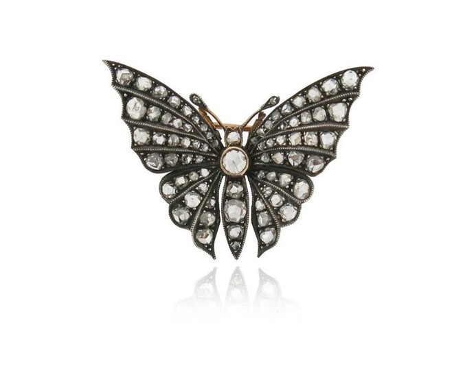 A diamond-set butterfly brooch, the rose-cut diamonds are...