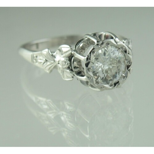 A diamond solitaire ring set in 18ct white gold and platinum...
