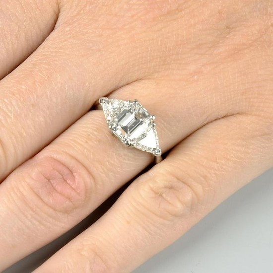 A diamond three-stone ring, with hinged band.Principal