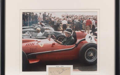 A framed photograph with signature of Mike Hawthorn in Ferrari...