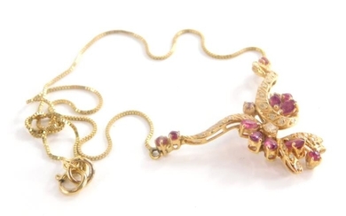 A garnet and cz set necklace, with floral design...