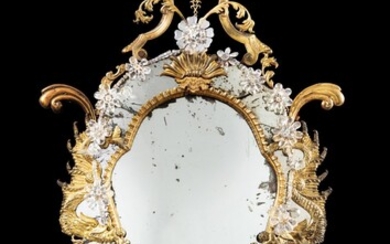 A gilt-copper and rock crystal mirror, Naples, circa 1750 | Miroir à fronton en cuivre doré et cristal de roche, travail napolitain, vers 1750