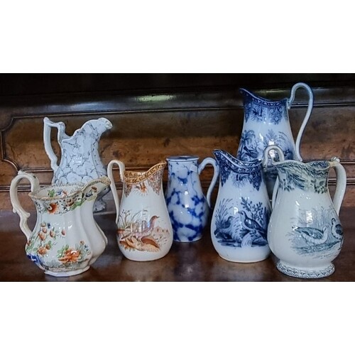 A group of seven Welsh pottery jugs to include; Llanelly pot...