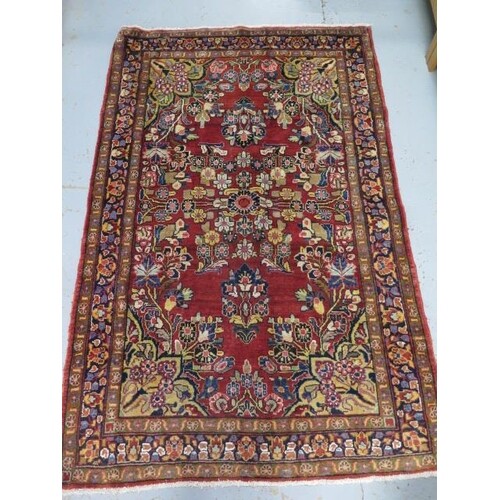A hand knotted woollen Lilian rug, 2.10m x 1.40m, in good co...