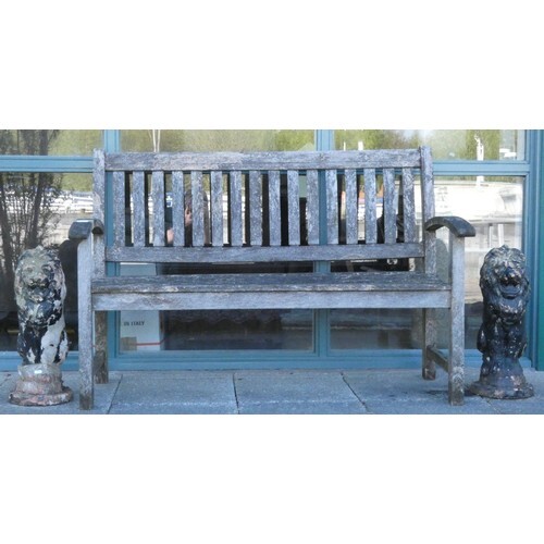 A hardwood garden seat 139cm long together with a pair of co...
