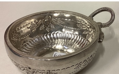 A large 19th Century French silver wine taster with chased v...