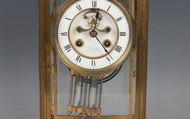 A late 19th century French brass four glass mantel clock with eight day movement striking on a gong