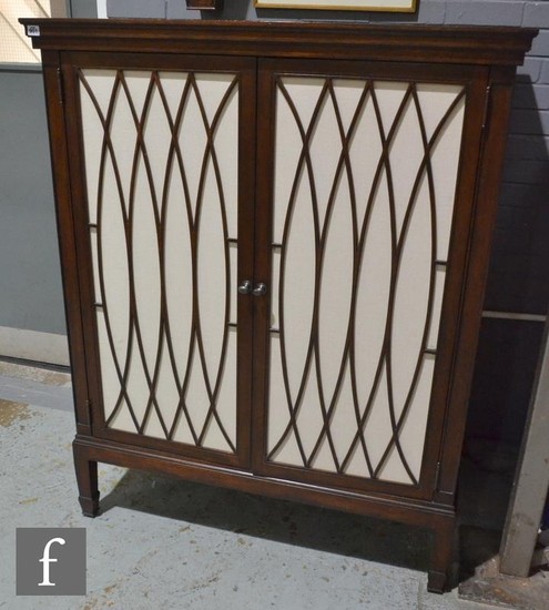 A late 20th Century reproduction mahogany cabinet, the corni...