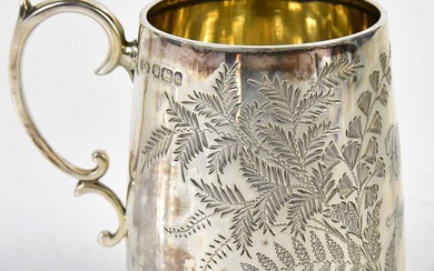 A late Victorian hallmarked silver christening cup with leaf engraved...