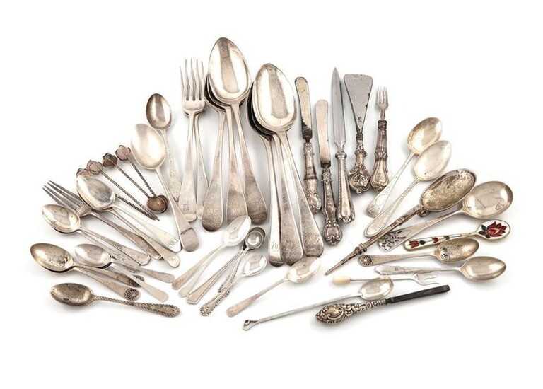A mixed lot of silver flatware, various dates and makers, comprising: six Old English pattern tablespoons, an Arts and Crafts spoon by Enid Kelsey, London 1935, a copy of a Roman spoon, two table forks, a jam spoon, seventeen tea and coffee spoons...