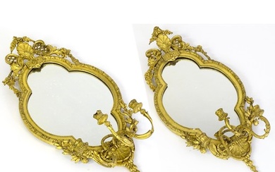 A pair of 19thC giltwood and gesso girandoles with shell mot...