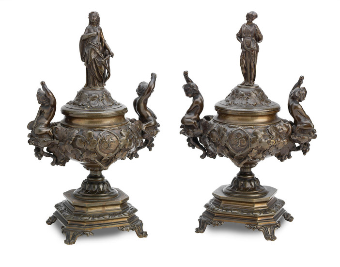 A pair of French late 19th Century bronze pedestal urns with covers