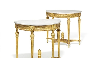 A pair of Gustavian giltwood 'demi lune' consoles with profiled white marble tops. Stockholm, early 18th century. H. 81 cm. W. 80 cm. D. 45 cm. (2)