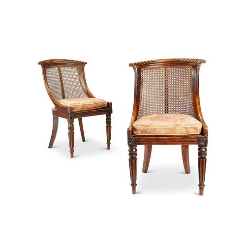 A pair of Regency simulated rosewood bergère side chairs The...