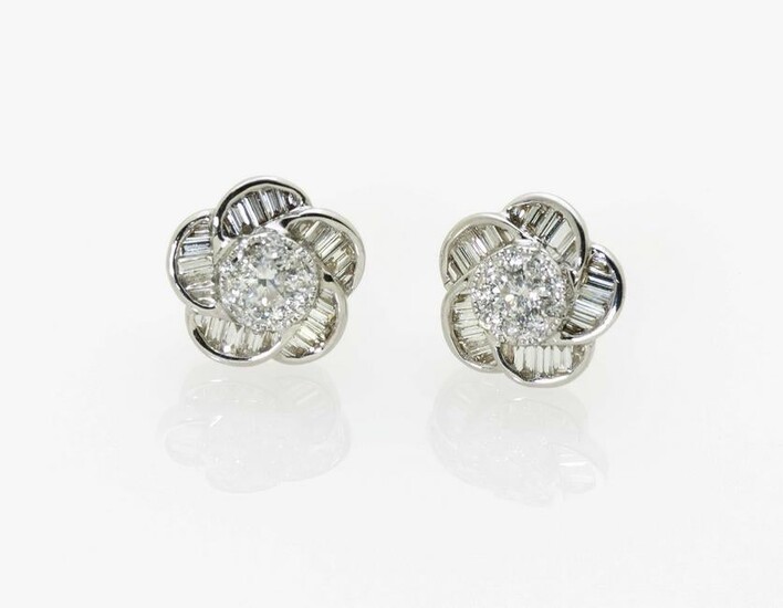 A pair of flower-shaped stud earrings with brilliant