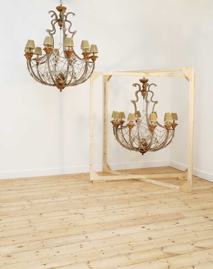 A pair of large beaded glass and giltwood ten-light chandeliers