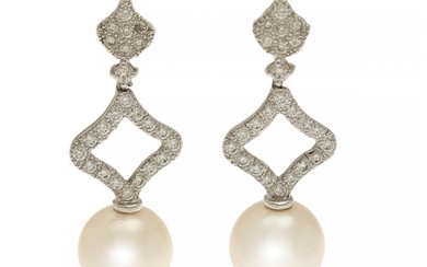 A pair of pearl and diamond ear pendants each set with a cultured South Sea pearl and numerous brilliant-cut diamonds, mounted in 18k white gold. (2)