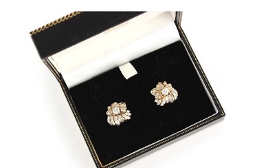 A pair of unmarked yellow gold diamond floral cluster earrin...