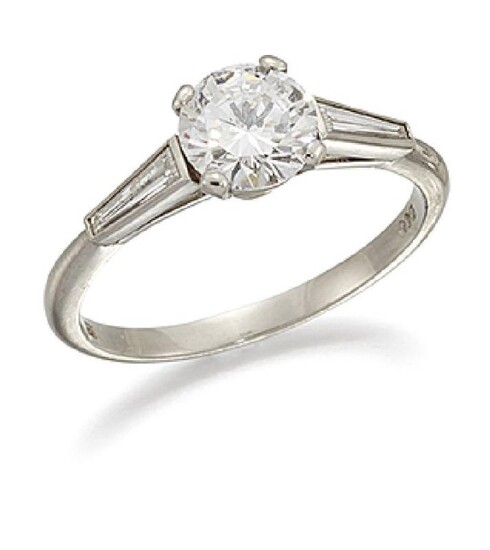 A platinum, diamond single stone ring by...